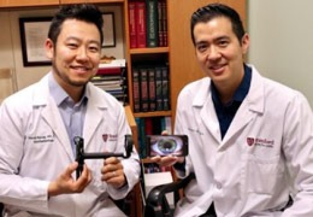 David Myung, MD, PhD, (left) and Robert Chang, MD, display the Paxos Scope, an ophthalmic camera system for smartphones they helped invent.